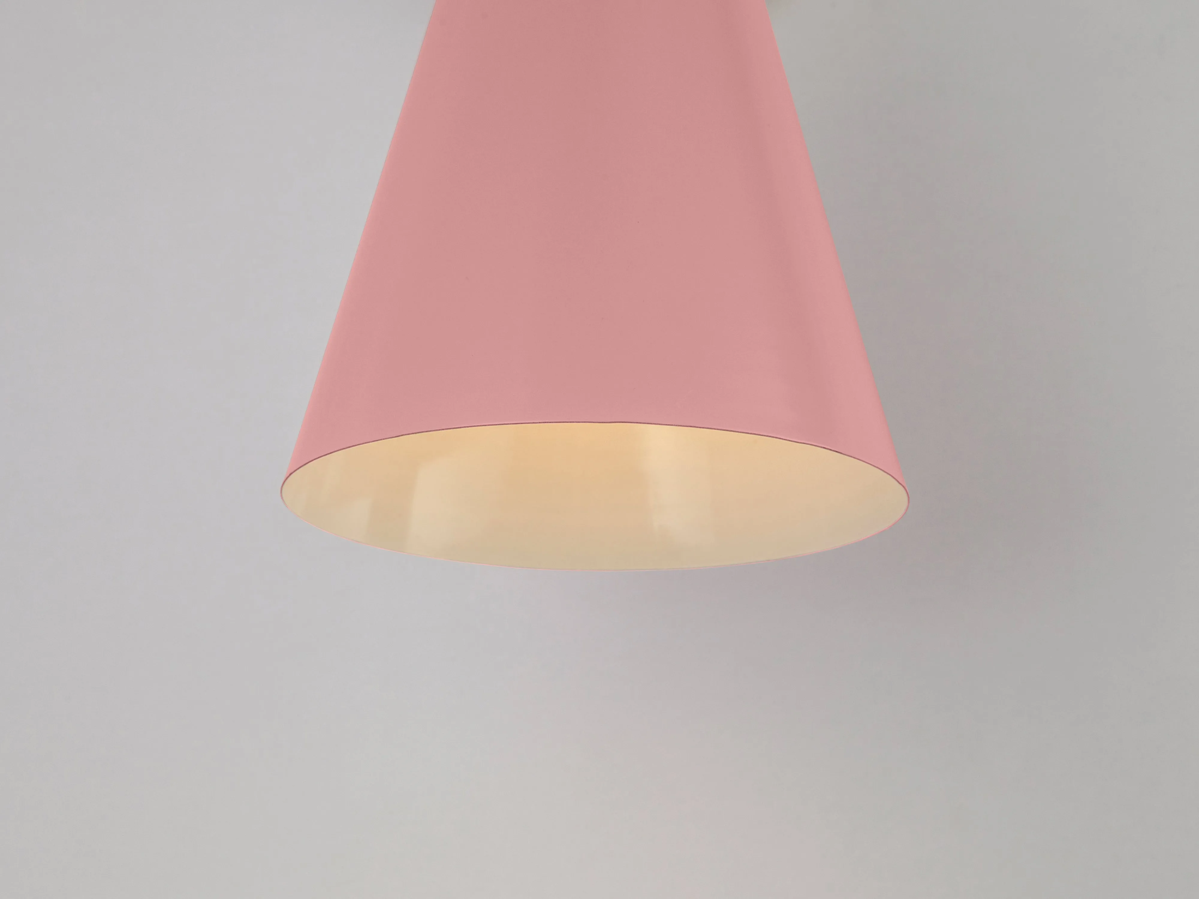 Pink cone shade wall light